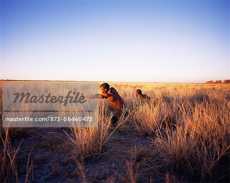 Bushmen Hunting in Grassy Field Namibia, Africa Bushmen Hunting in Grassy Field Namibia, Africa