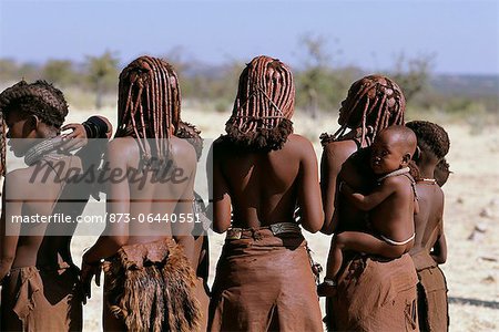 Rear-View of Himba Tribe Standing Outdoors Namibia, Africa