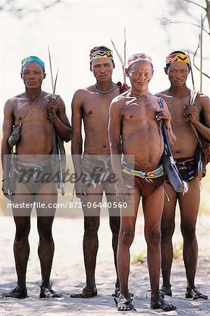 Portrait of Bushman Hunters with Bows, Arrows and Quivers Outdoors Namibia, Africa