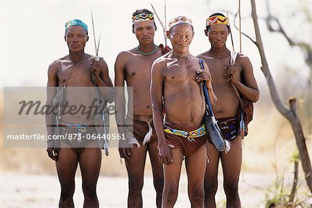 Portrait of Bushman Hunters with Bows, Arrows and Quivers Outdoors Namibia, Africa