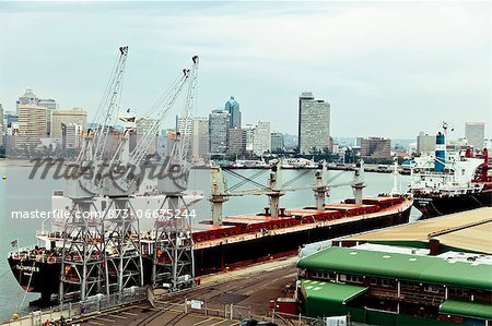 Crane superstructures next to moored ship, Durban Harbor Crane superstructures next to moored ship, Durban Harbor