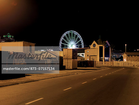 Cape Town streets at night with a Ferris Wheel in background