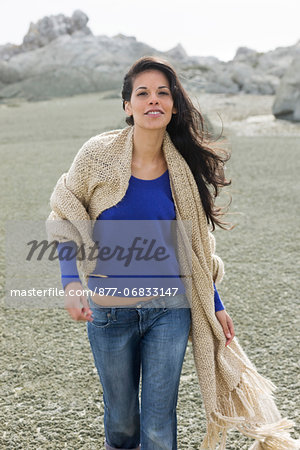 Young woman with shawl at seaside