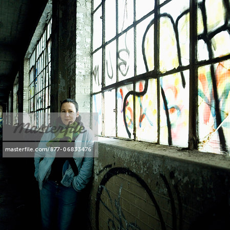 Woman in disused plant