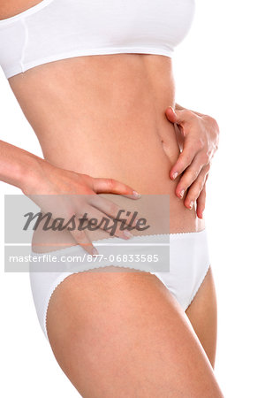 Woman in underwear with her hands on her stomach - Stock Photo - Masterfile  - Rights-Managed, Artist: Photononstop, Code: 877-06833585