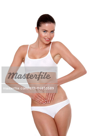 Woman in underwear with her hands on her stomach - Stock Photo - Masterfile  - Rights-Managed, Artist: Photononstop, Code: 877-06833585