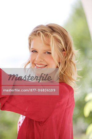 Portrait of woman looking at the camera, smiling