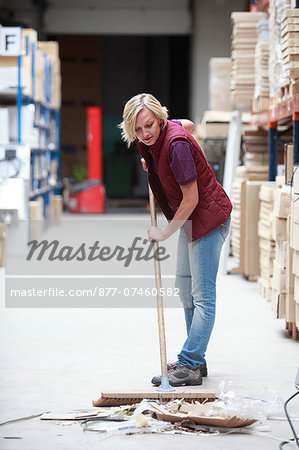 France, young woman working in a warehouse.