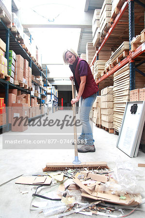 France, young woman working in a warehouse.
