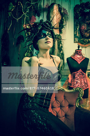 Neo baroque woman sitting in black dress Neo baroque woman sitting in black dress
