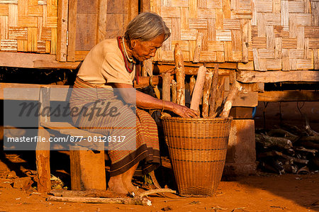 Camdodia, Ratanakiri Province, Phomkres village, Pot At prepares a wooden hood