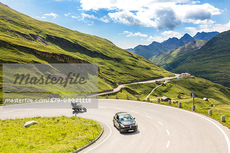 Car and motorbike on the serpentines of Hohe Tauern Grossglockner High Alpine Road , High Tauern National Park, Carinthia, Austria
