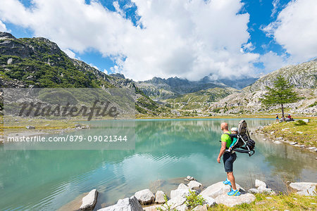 Tourist to the lower Cornisello lake Europe, Italy, Trentino region, Nambrone valley, Rendena valley, Carisolo, Sant'Antonio di Mavignola, Madonna di Campiglio