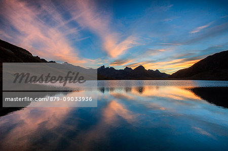 Sunrise reflection at Malghera lake, Grosina valley, Valtellina, Lombardy, Italy