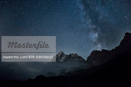 The milky way lights up the sky over Monviso. Lake Superior, Cozian Alps, Piedmont, Italy Europe