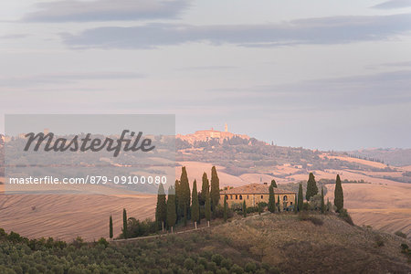 San Quirico d'Orcia, Province of Siena, Orcia Valley, Tuscany, Italy, Europe. View of Podere Belvedere at sunset with Pienza on the background