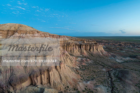 White stupa sedimentary rock formations at dusk. Ulziit, Middle Gobi province, Mongolia.