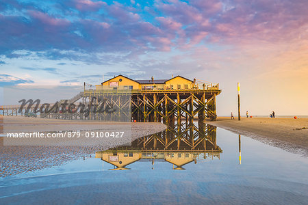 Sankt Peter-Ording, Eiderstedt, North Frisia, Schleswig-Holstein, Germany. Stilt house on the Wadden sea with low tide.