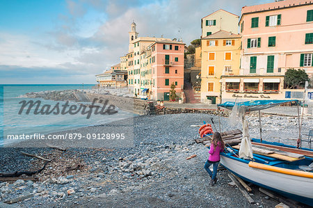 Tourist admiring the seascape of Boccadasse, Province of Genoa, Liguria, Italy