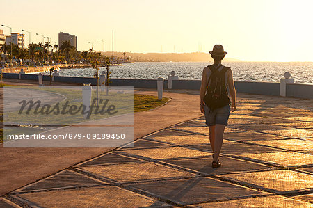 A tourist walk on Campeche promenade at sunset, San Francisco de Campeche, state of Campeche, Mexico.