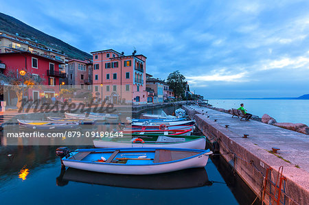 Twilight at the little harbour of Macugnano, Brenzone sul Garda, Garda Lake, Verona province, Veneto, Italy, Europe.