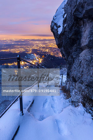 View of Santa Maria del Monte, Varese and the Pianura Padana after a snowfall from the trail on the east side of the Campo dei Fiori massif. Campo dei Fiori, Varese, Parco Campo dei Fiori, Lombardy, Italy.