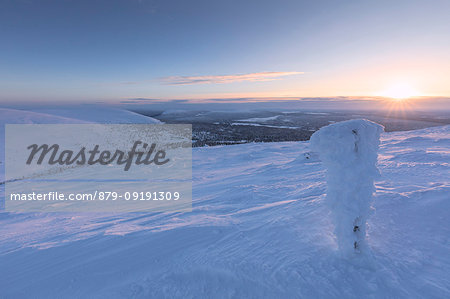 Sunrise on the frozen landscape covered with snow, Pallas-Yllastunturi National Park, Muonio, Lapland, Finland