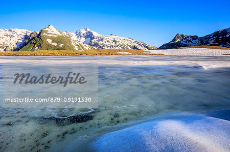 Ice melting at Lake Andossi during thaw, Chiavenna Valley, Spluga Valley, Sondrio province, Valtellina, Lombardy, Italy