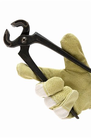 simsearch:400-04021777,k - Gloved hand holding a working tool. Isolated on a white background. Foto de stock - Royalty-Free Super Valor e Assinatura, Número: 400-04004056