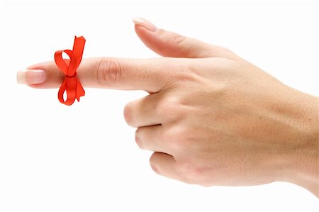 finger knot reminder - Finger with red bow pointing left. Isolated on a white background. Stock Photo - Budget Royalty-Free & Subscription, Code: 400-04004059