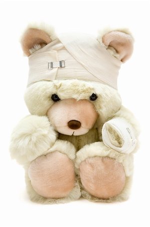 Wounded teddy bear. Isolated on a white background. Stock Photo - Budget Royalty-Free & Subscription, Code: 400-04004063