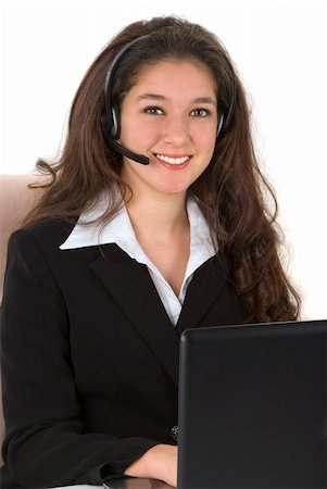 simsearch:400-03985399,k - Beautiful professionally dressed young businesswoman with her headset and computer Foto de stock - Royalty-Free Super Valor e Assinatura, Número: 400-04004131