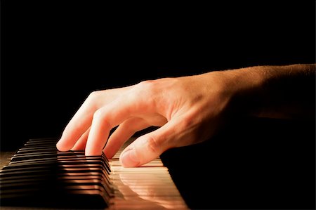 piano practice - Caucasian male's hand playing the piano Stock Photo - Budget Royalty-Free & Subscription, Code: 400-04004452