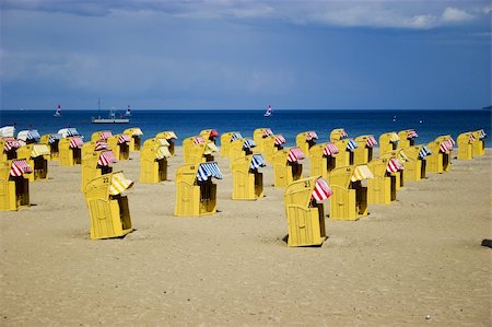 Beach wicker chairs with numbers on back in Germany near Baltic sea Stock Photo - Budget Royalty-Free & Subscription, Code: 400-04004600