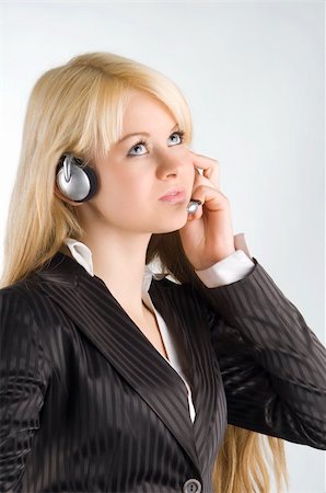 simsearch:400-03996848,k - cute blond girl chatting with earphone and looking up Fotografie stock - Microstock e Abbonamento, Codice: 400-04005290