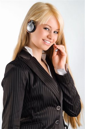 simsearch:400-03996848,k - cute blond hostess chatting with earphone and smiling Fotografie stock - Microstock e Abbonamento, Codice: 400-04005293