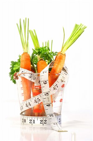 simsearch:400-07982459,k - Carrots in a measuring cup with tape measure on white background Foto de stock - Super Valor sin royalties y Suscripción, Código: 400-04005328