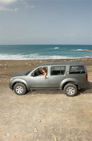 simsearch:851-02963125,k - Woman and her 4wd car at Fuerteventura's beach Photographie de stock - Aubaine LD & Abonnement, Code: 400-04005927