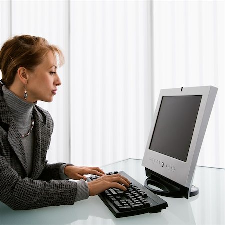 Caucasian woman typing on computer keyboard. Stock Photo - Budget Royalty-Free & Subscription, Code: 400-04006195
