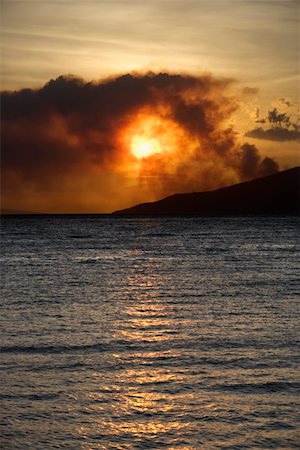 simsearch:400-04006465,k - Dark clouds at sunset over water on Maui, Hawaii. Stock Photo - Budget Royalty-Free & Subscription, Code: 400-04006465