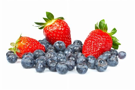 simsearch:400-04433511,k - Blueberries and fresh tasty strawberries with soft shadow on white background. Shallow depth of field Stock Photo - Budget Royalty-Free & Subscription, Code: 400-04006761