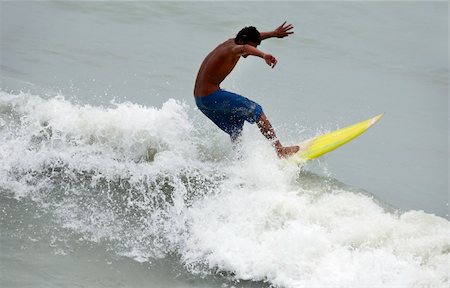 simsearch:400-07212727,k - Young men - the surfer in ocean. Bali Stock Photo - Budget Royalty-Free & Subscription, Code: 400-04006961
