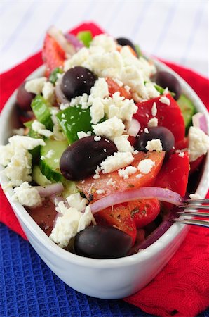 person eating greek salad - Greek salad with feta cheese and black kalamata olives Stock Photo - Budget Royalty-Free & Subscription, Code: 400-04007235