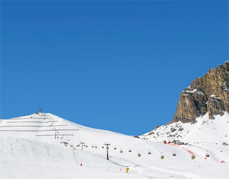 snow rocks and nice mountians over blue sky Foto de stock - Super Valor sin royalties y Suscripción, Código: 400-04007624