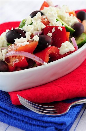 person eating greek salad - Greek salad with feta cheese and black kalamata olives Stock Photo - Budget Royalty-Free & Subscription, Code: 400-04008379