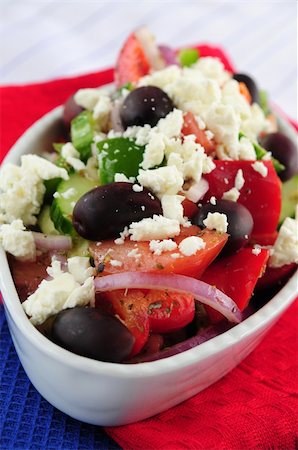person eating greek salad - Greek salad with feta cheese and black kalamata olives Stock Photo - Budget Royalty-Free & Subscription, Code: 400-04008380