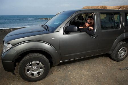 simsearch:851-02963125,k - Woman and her 4wd car at Fuerteventura's beach Photographie de stock - Aubaine LD & Abonnement, Code: 400-04008428