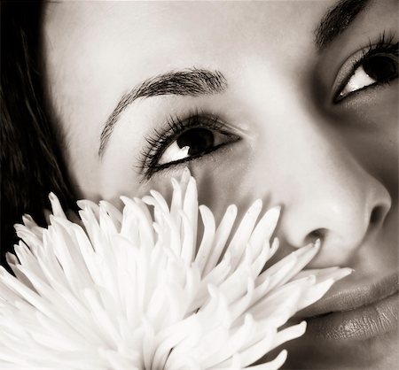 simsearch:400-08096297,k - Macro image of a girl face with a white flower Stock Photo - Budget Royalty-Free & Subscription, Code: 400-04008422