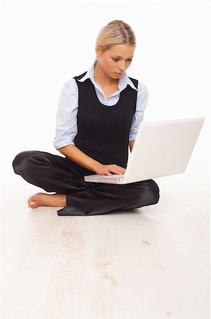 simsearch:400-04008684,k - Businesswoman working on her laptop while sitting on the floor Stockbilder - Microstock & Abonnement, Bildnummer: 400-04008488
