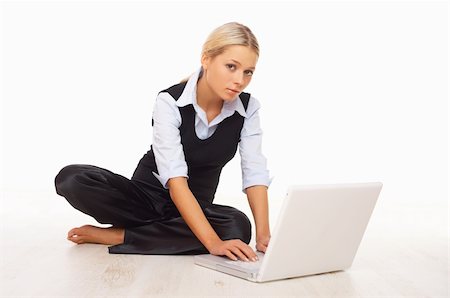 simsearch:400-04008684,k - Businesswoman working on her laptop while sitting on the floor Stockbilder - Microstock & Abonnement, Bildnummer: 400-04008489